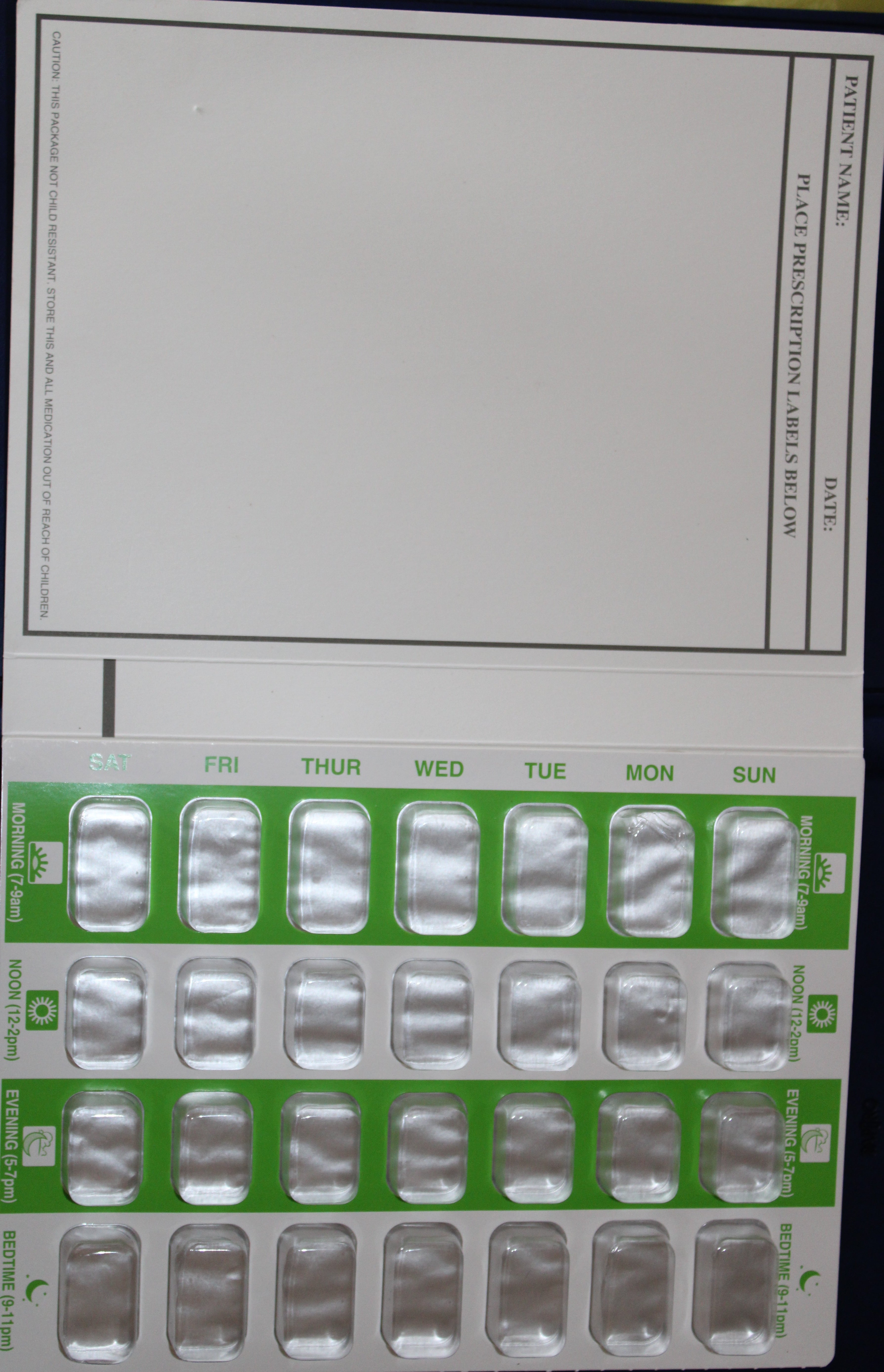 Prescription label with medication slots for a 7-day pill organizer.