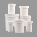 Set of white plastic containers with varying sizes on a gray background
Plastic ointment jars for pharmacy compounding and medication storage